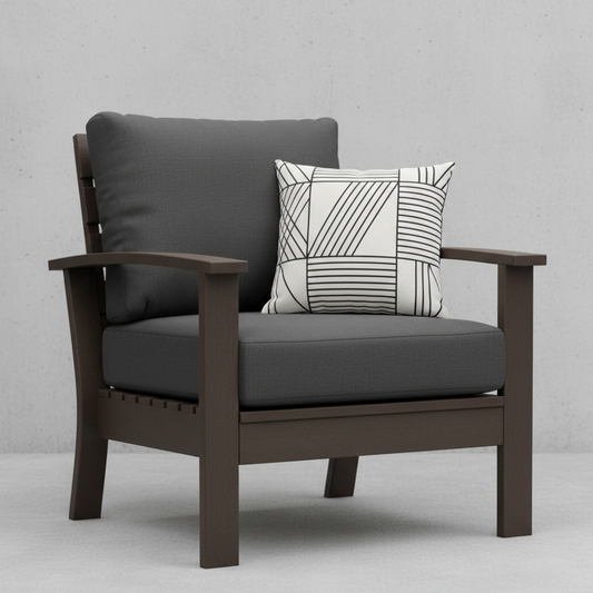 Deep seating replacement cushions in dark colors on outdoor furniture surrounded by greenery.