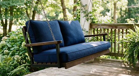 Outdoor swing cushion in weatherproof fabric on porch glider in natural light
