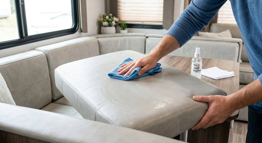 Wiping down an RV vinyl cushion with mild soap and water