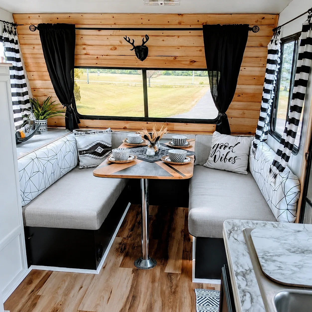 Custom black and white RV dinette cushions for a camper remodel