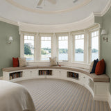 Custom curved bay window seat cushion for a built-in storage bench