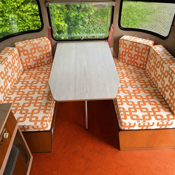 Custom orange retro camper dinette cushions for booth seating