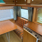 Custom plaid RV dinette cushions for a retro camper interior