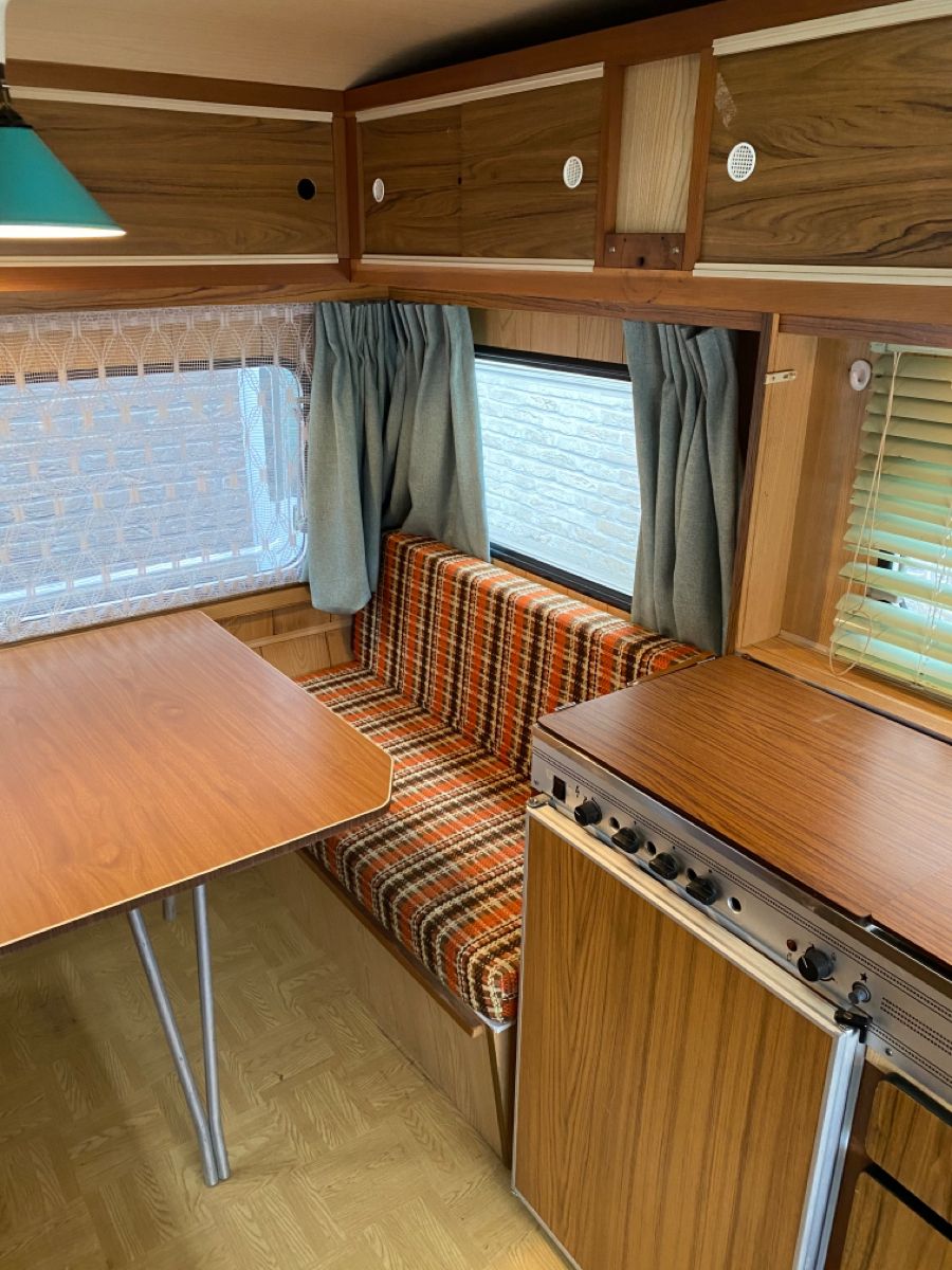 Custom plaid RV dinette cushions for a retro camper interior