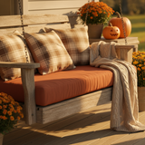 Beautiful bench cushion in rich forest green with a subtle pattern on an outdoor patio
