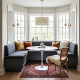 Pastel blue and green cushions on a cozy breakfast nook bench