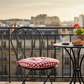 Dark chairs with pads in a stylish kitchen, offering stain hiding benefits