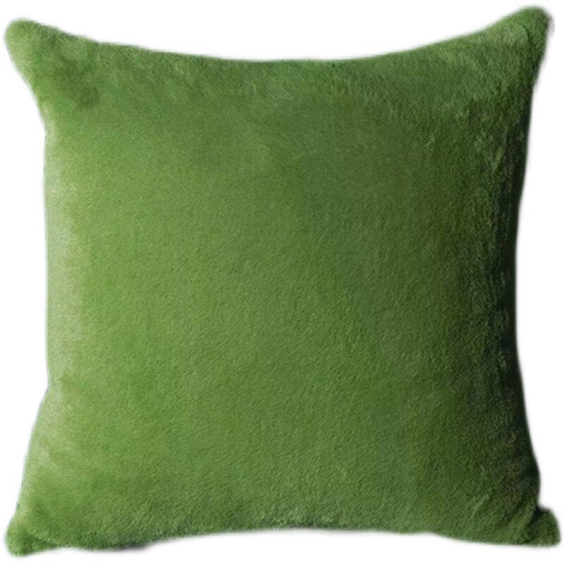 Close-up of soft double-sided faux fur texture on forest green throw pillow cover