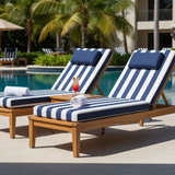 Cushioned outdoor chaise lounge in rich navy with a geometric pattern in a vibrant garden.