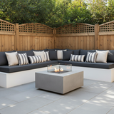 Custom bench cushions in soft pastel colors arranged in a cozy nook.