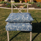 Custom blue palm leaf outdoor dining chair cushion for a patio