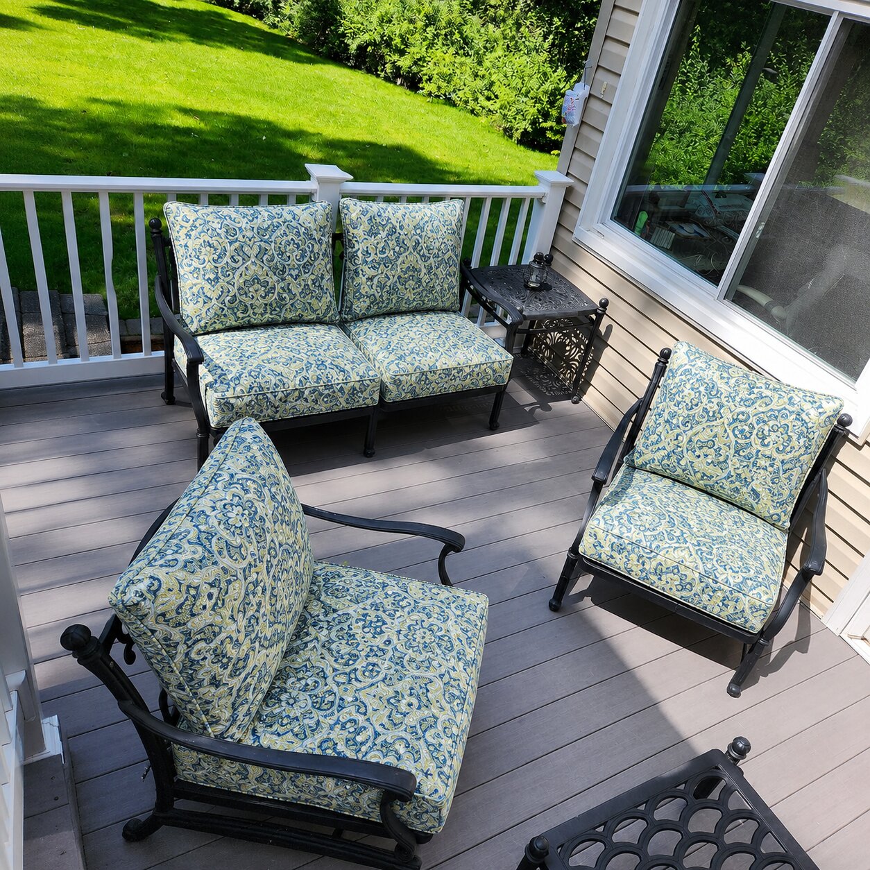 Custom blue and yellow paisley patio chair cushions for deck seating