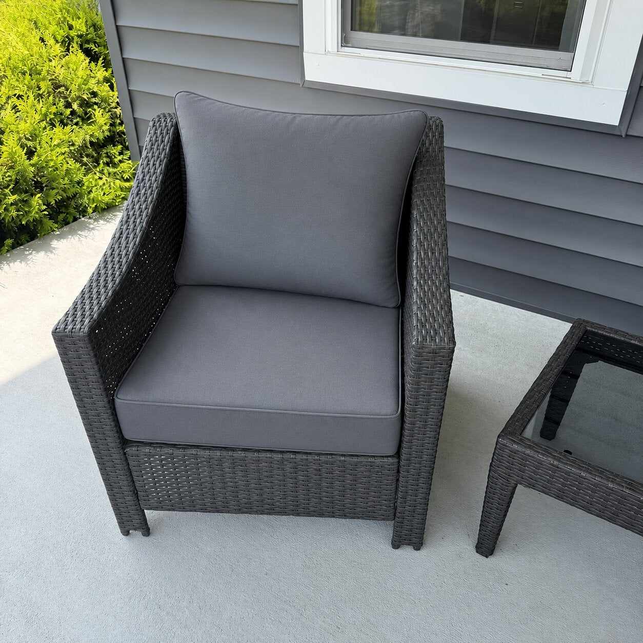 Custom charcoal gray wicker patio chair cushion for an outdoor chair