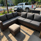 Custom dark gray outdoor sectional cushions with a patio ottoman