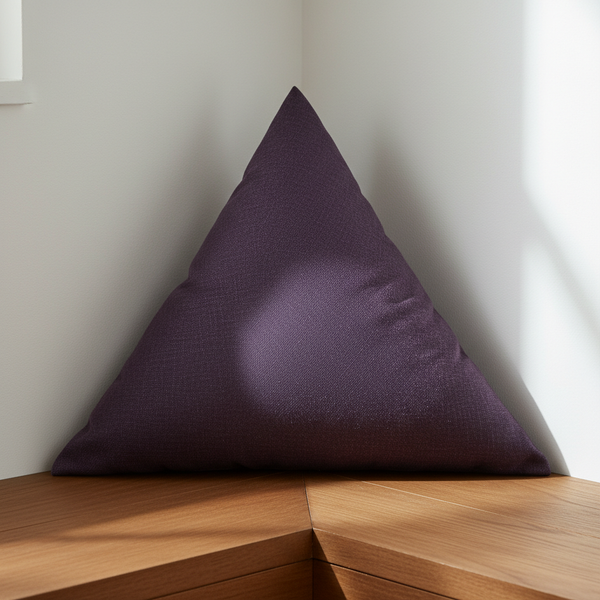 Custom Equilateral Triangle Cushions in a cozy living room setting, emphasizing their unique shape and vibrant color.