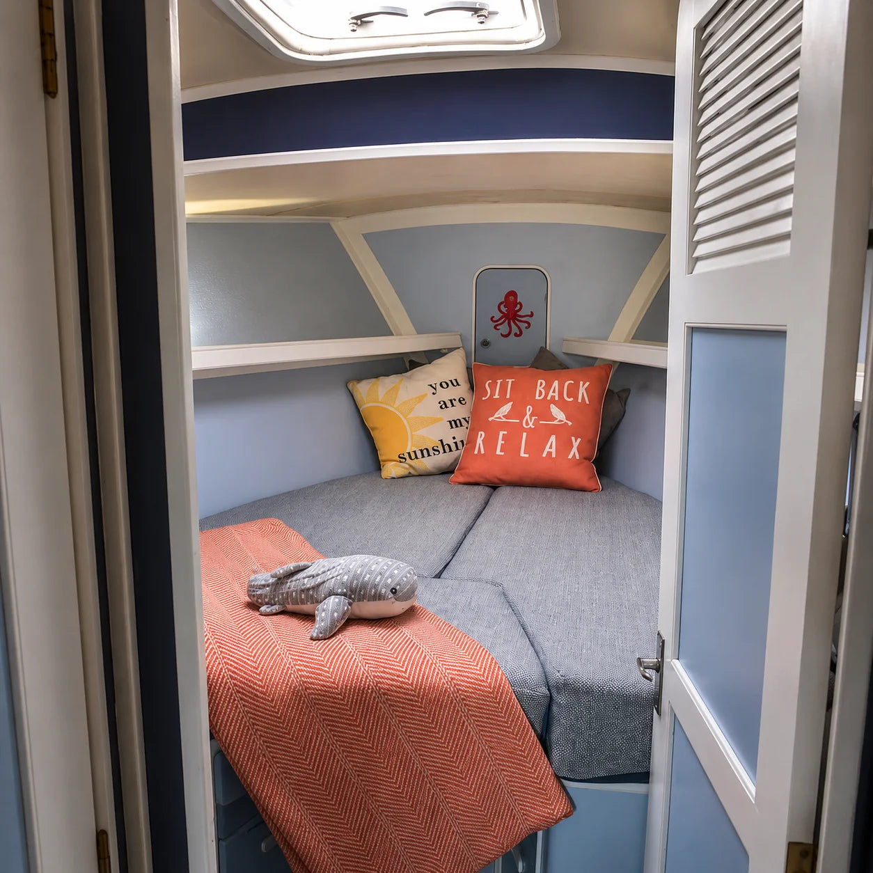 Custom gray boat V-berth cushions for a cabin sleeping area