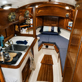 Custom gray boat V-berth cushions for yacht cabin seating