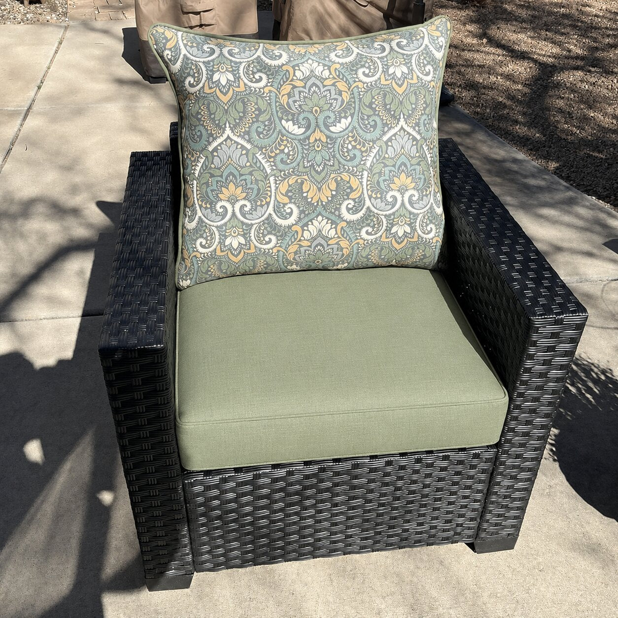 Custom sage green wicker armchair cushion with a paisley back pillow