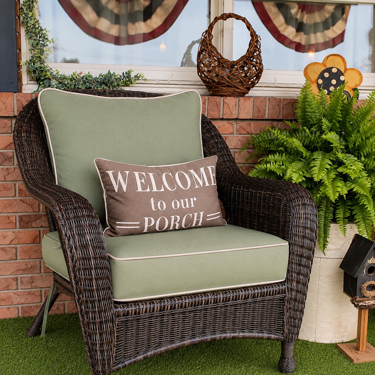 Custom sage green wicker porch chair cushions with a welcome pillow