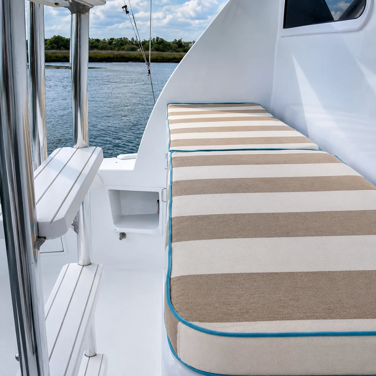 Custom striped boat sun pad cushions for bow lounge seating