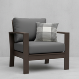 Deep seating replacement cushions in navy blue on an outdoor patio