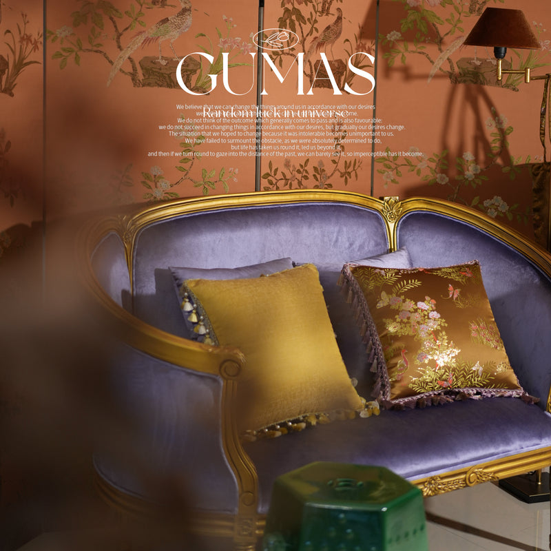 Detailed view of hand-sewn purple and gold tassel fringe on luxury brocade pillow cover