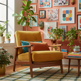 Deep outdoor cushions in navy blue and charcoal grey on a patio with lush greenery