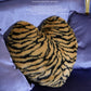 Heart shaped tiger stripe pillow 18x22 inches on vintage upholstered furniture