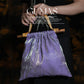 Lavender purple metallic evening bag with bamboo handles and iridescent geometric pattern