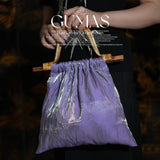 Lavender purple metallic evening bag with bamboo handles and iridescent geometric pattern
