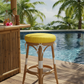 Brightly colored lawn chair cushions in a scenic garden