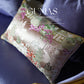Pink silk jacquard pillow cover with Eastern cloud motifs styled on neutral sofa