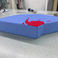 One interlocking piece of the custom puzzle floor cushion, a thick standalone foam cushion