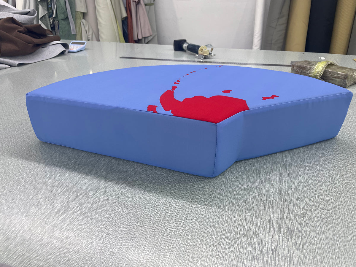 One interlocking piece of the custom puzzle floor cushion, a thick standalone foam cushion