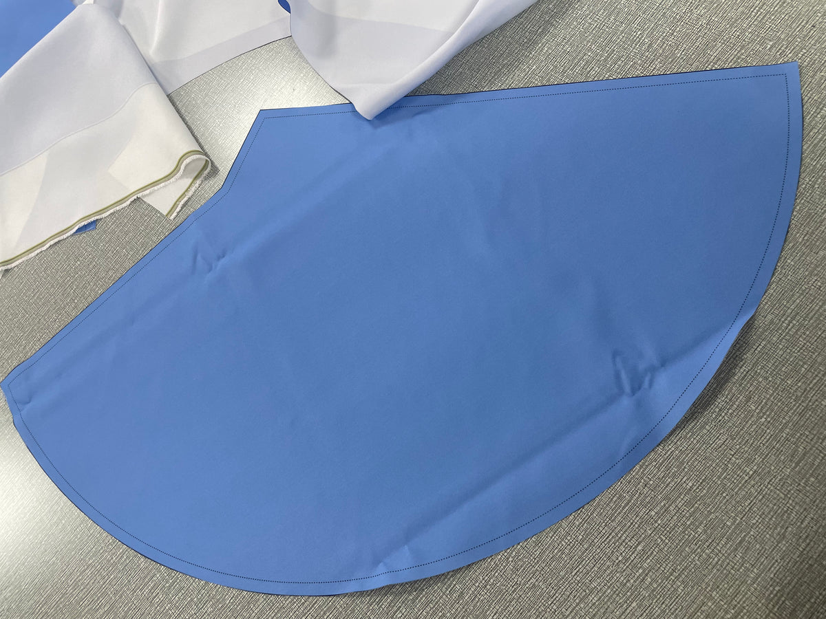 Custom cushion cover panel cut to shape during production of the puzzle floor cushion