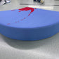 Side profile of a puzzle floor cushion piece showing the firm foam thickness
