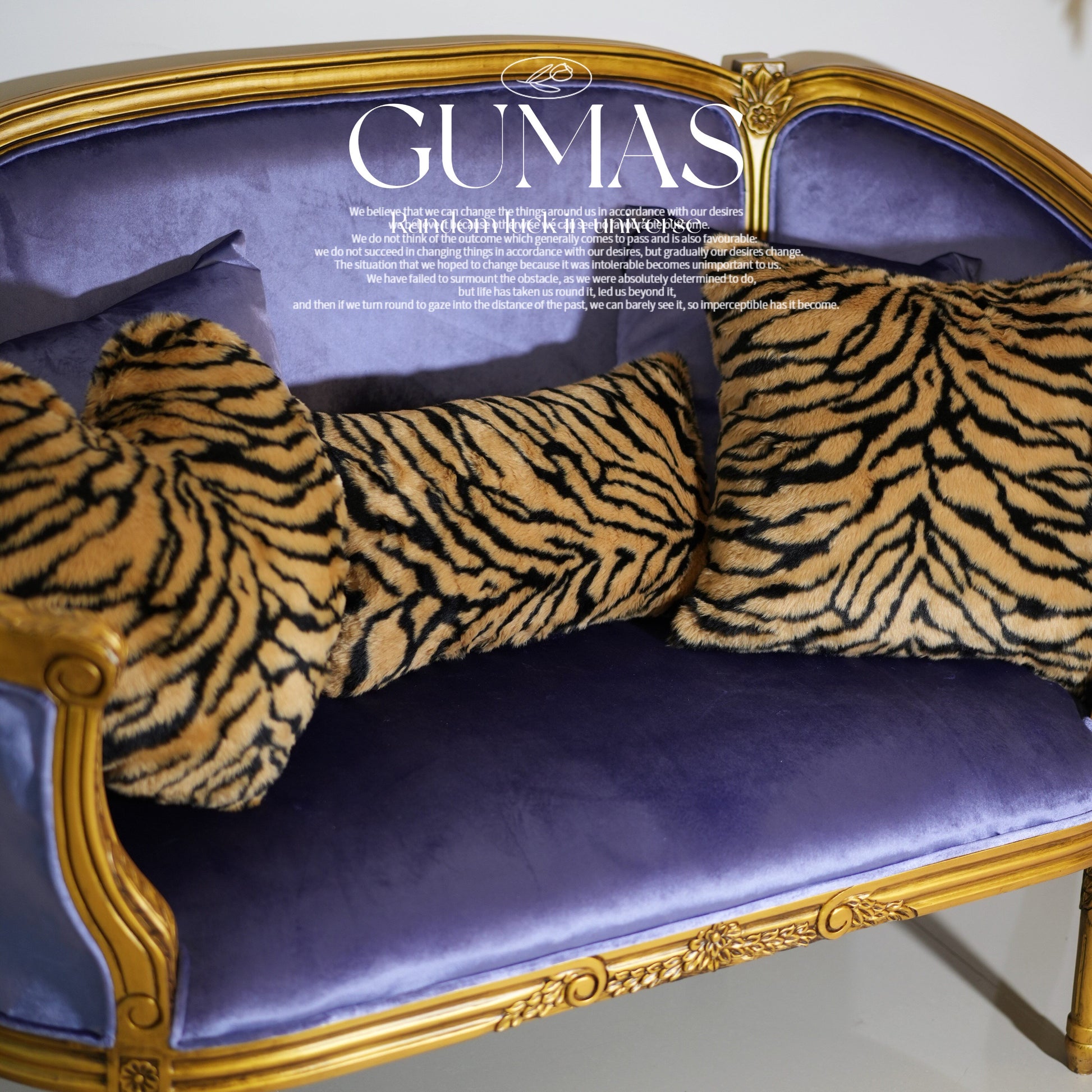 Tiger stripe plush velvet throw pillow in periwinkle blue with gold and black stripes on baroque chair