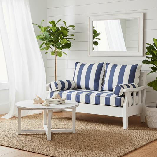 Stylish wicker loveseat cushions in earthy tones on a patio surrounded by greenery.