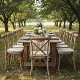 Soft blue and sage green window seat cushion with greenery in a cozy nook